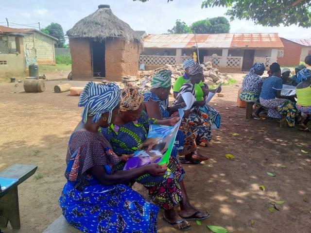 Women from a cooperative gathered in a village for a capacity-building training focused on agricultural advice.