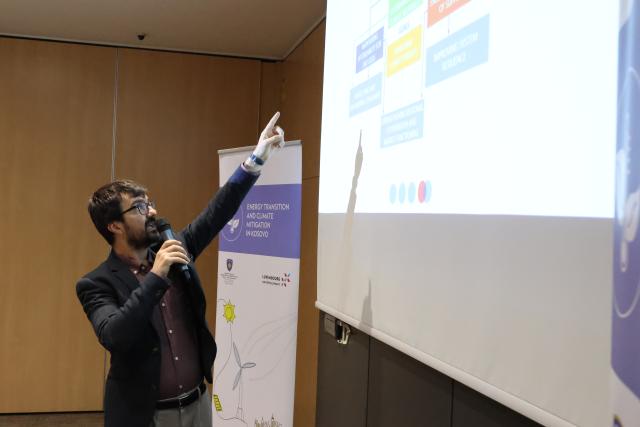 Presenter pointing out to screen during workshop