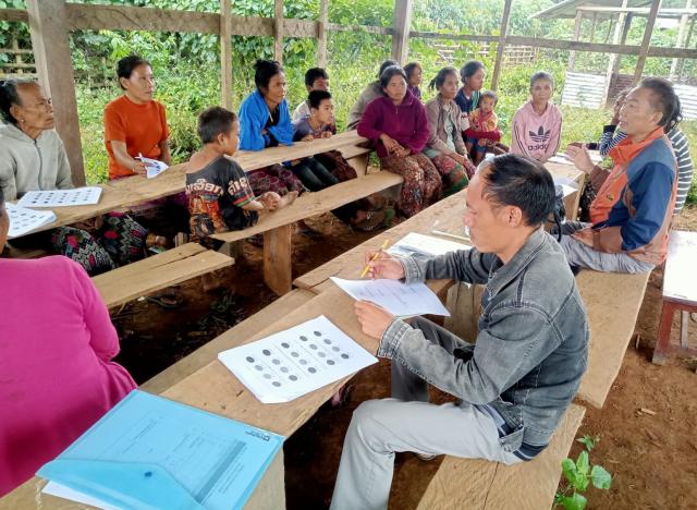 Villager at meeting