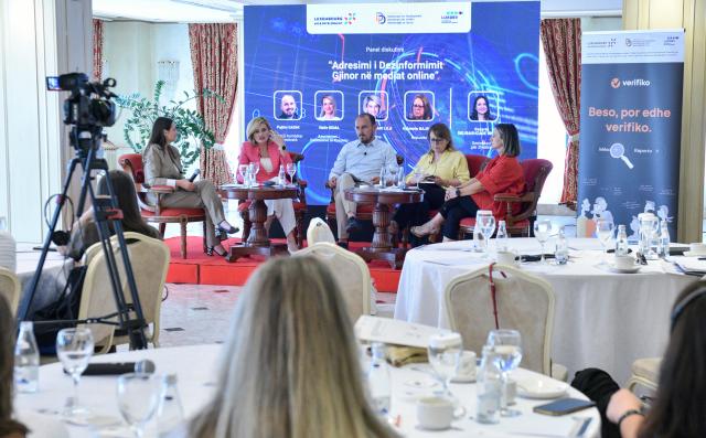 Panelists discussing at conference