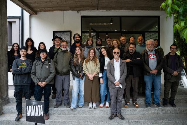 GRAN Fest team, artists and participants posing in front of building ahead of movie screening