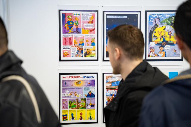 Visitors at an exhibition as part of GRAN Fest exhibition at University of Pristina