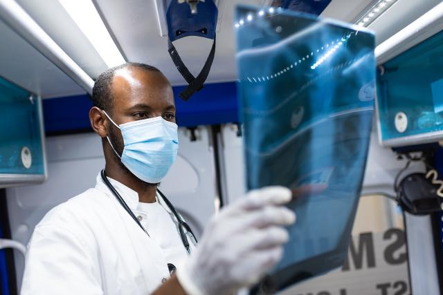 Emergency doctor consulting an X-ray