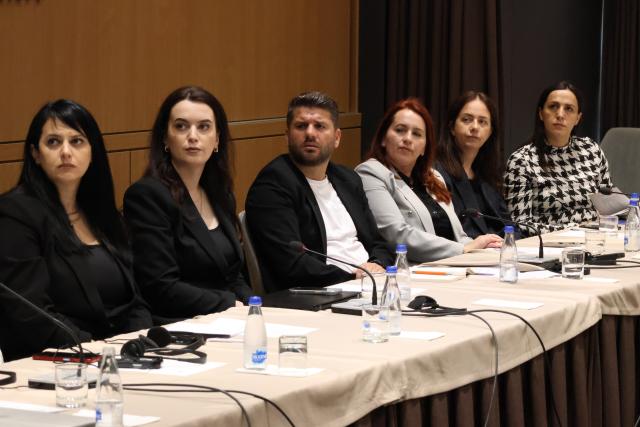 Participants listening to a presentation at a workshop