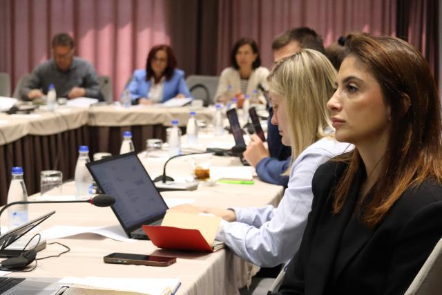 Participants listening to presentation at a workshop