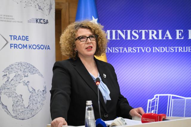 Minister speaking at the booth