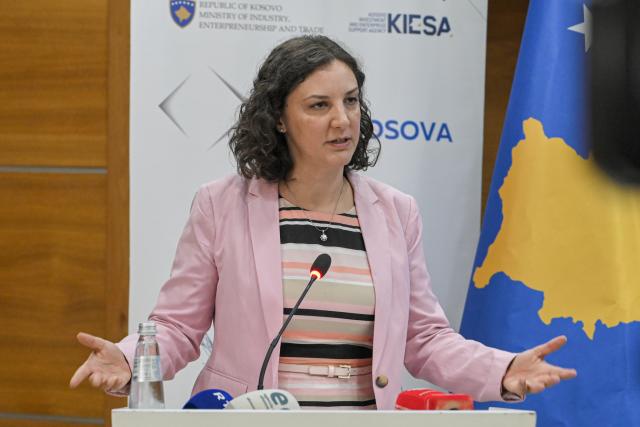 Minister speaking at the booth
