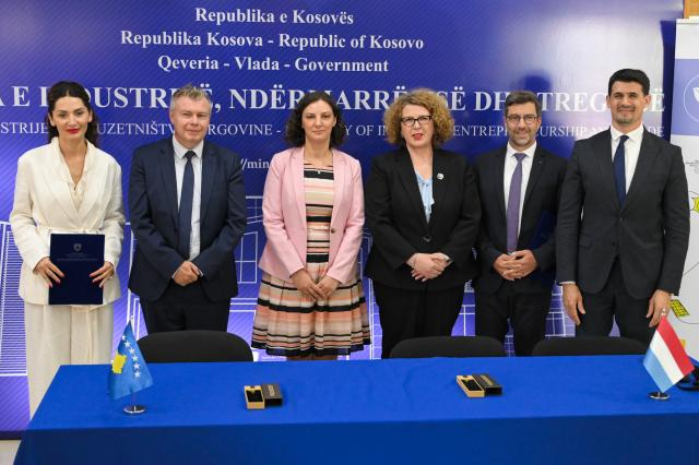 Officials posing after signing agreement